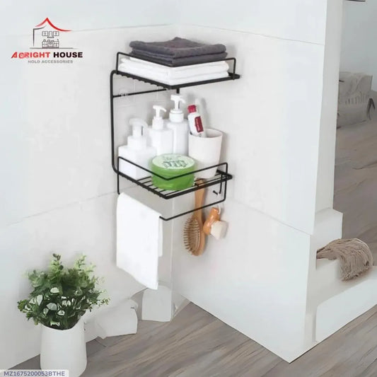 Black two-tier stainless steel bathroom wall organizer holding towels toiletries and hanging accessories