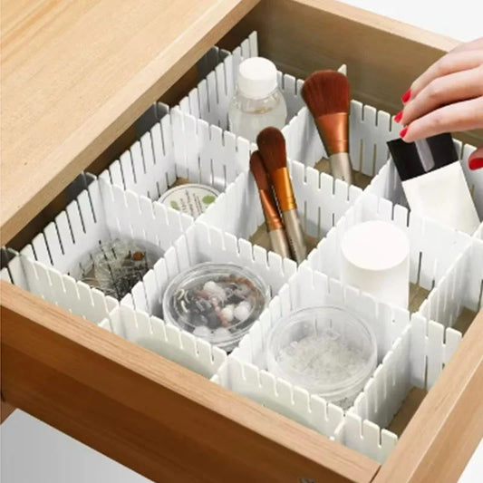 White adjustable plastic drawer dividers organizing cosmetics and small items