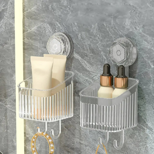 Transparent bathroom shelves mounted on tile holding toiletries with hooks underneath