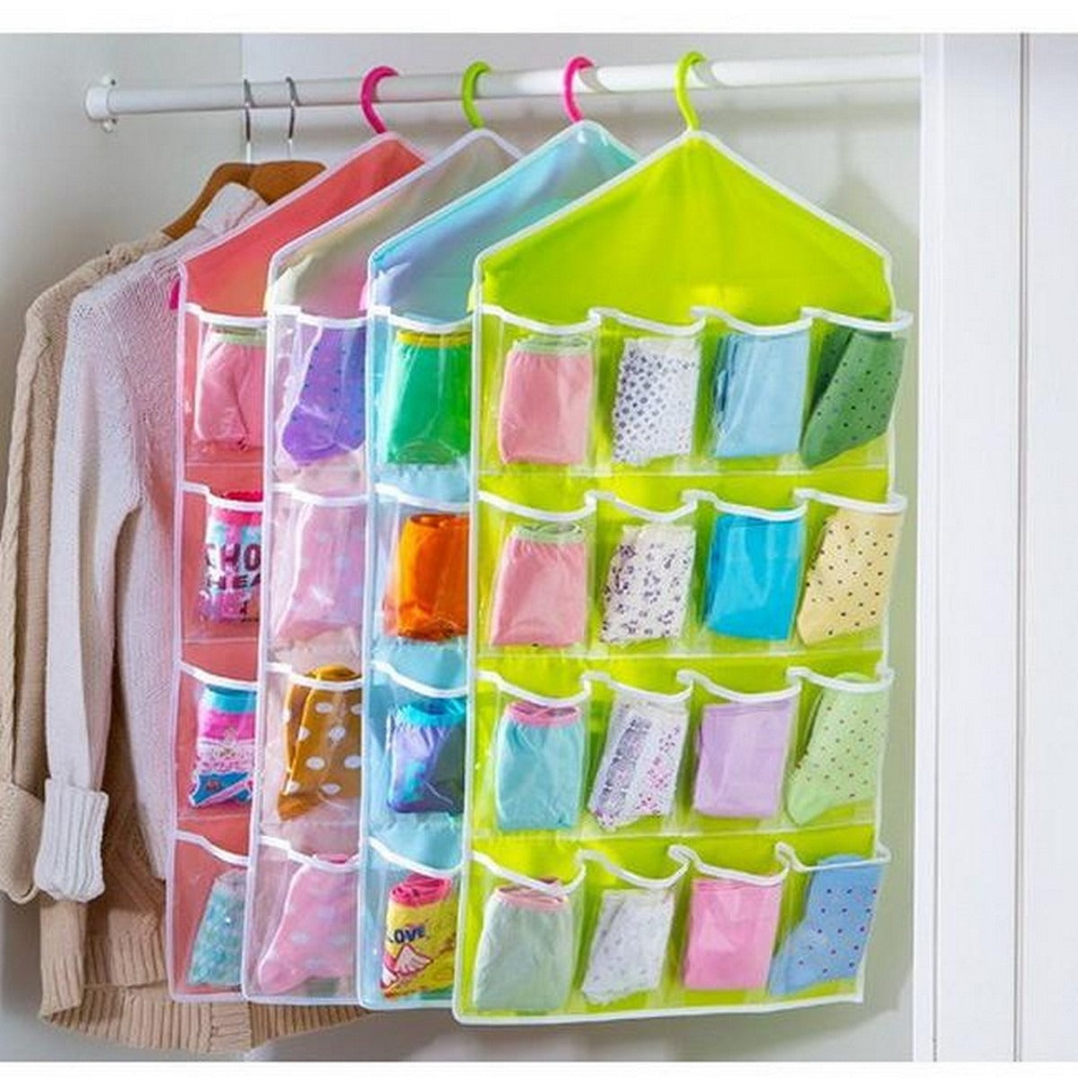16-pocket hanging organizers in assorted colours hanging in a wardrobe