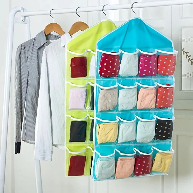 Blue and green hanging organizers with 16 front pockets on a wardrobe rail