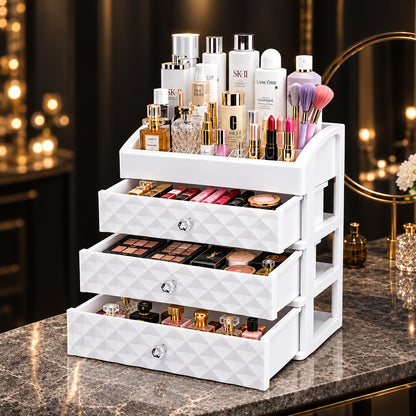 White cosmetic organizer with three drawers open and beauty products stored inside