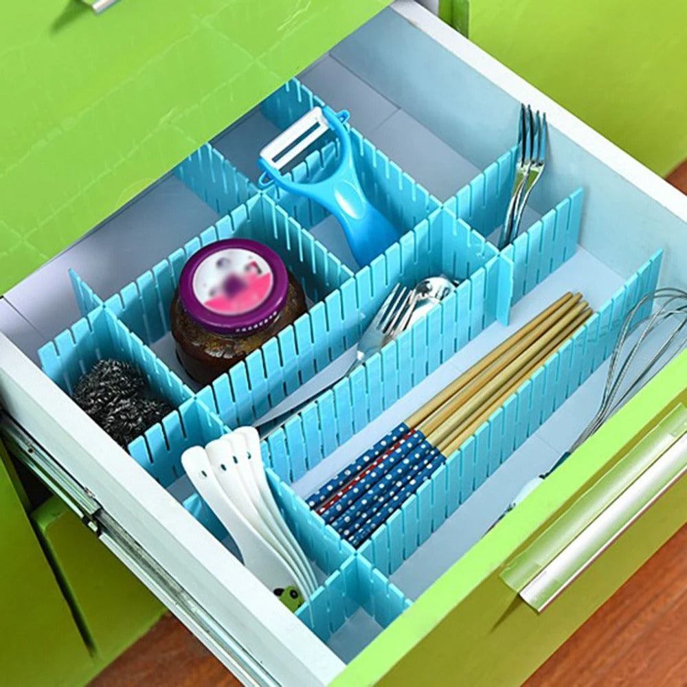 Blue adjustable plastic drawer dividers organizing kitchen utensils