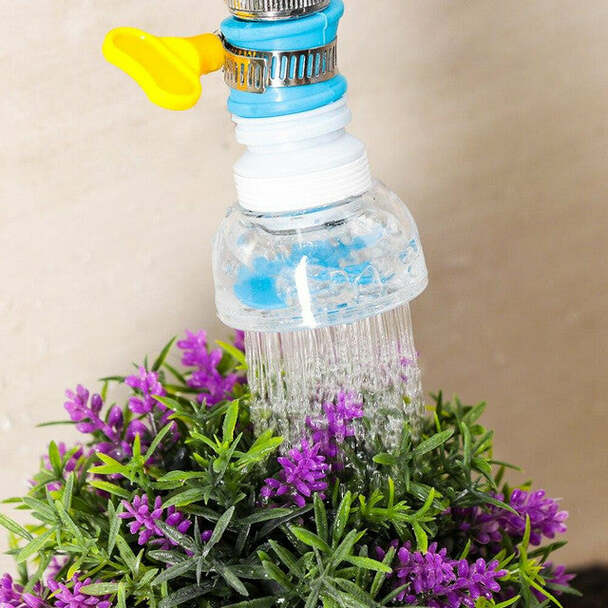 Faucet spray extender directing water onto household plants