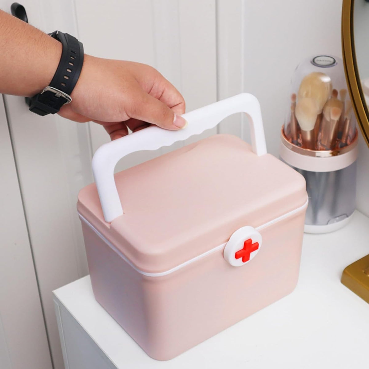 Portable first-aid storage box in pink with carry handle and front latch