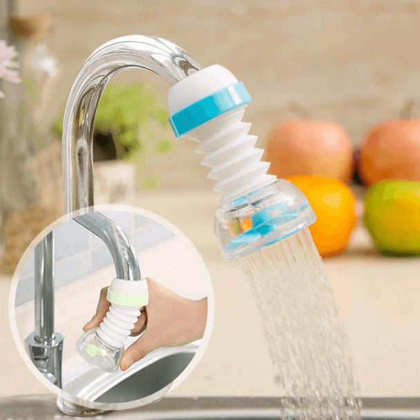 Blue flexible faucet spray nozzle installed over a kitchen sink