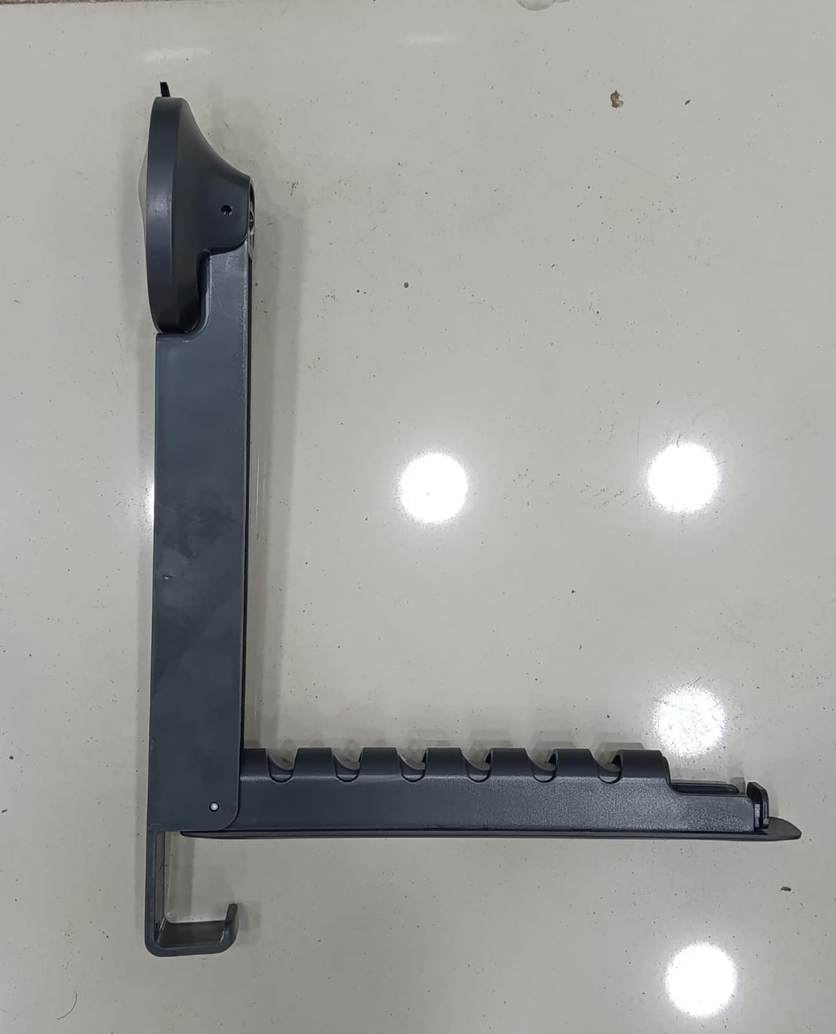 Close-up of black foldable suction-cup clothes drying rack