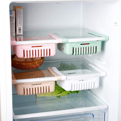 Hanging refrigerator storage baskets in multiple colours under fridge shelves