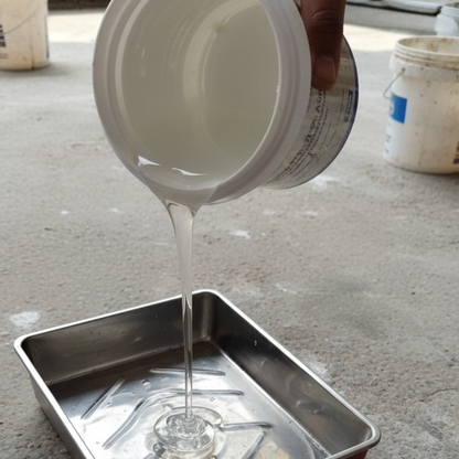 Clear waterproofing sealant liquid being poured from its container