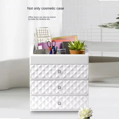 White three-drawer organizer shown holding office stationery in the top compartment