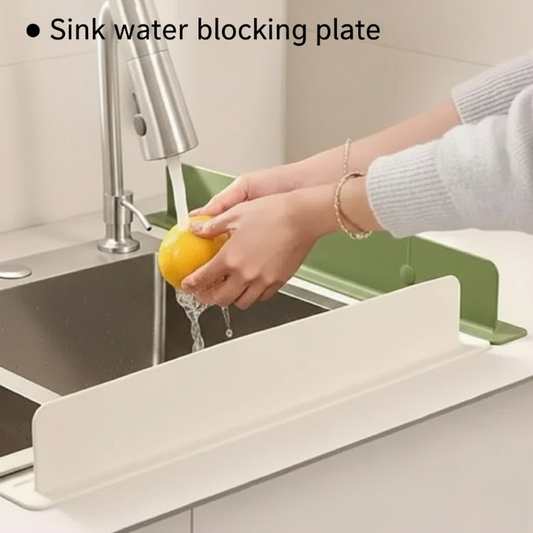 Silicone sink splash guard installed along a kitchen sink edge to help block water splashes