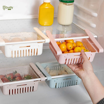 Stretchable refrigerator basket organizer holding fruit under a fridge shelf