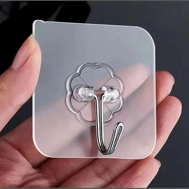 Close-up of transparent adhesive wall hook with silver metal hook