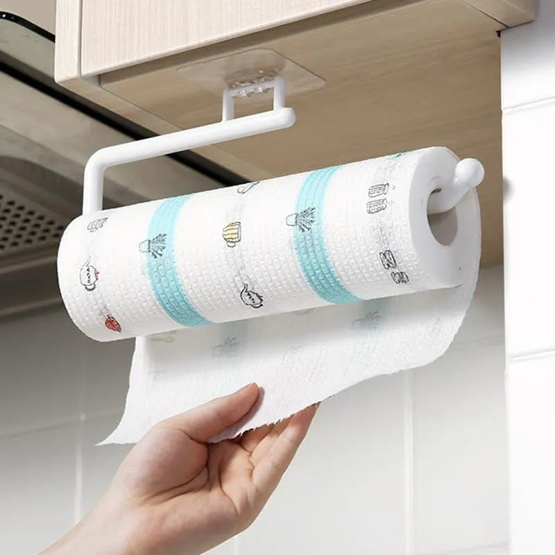 White under-cabinet paper towel holder mounted below a kitchen cabinet