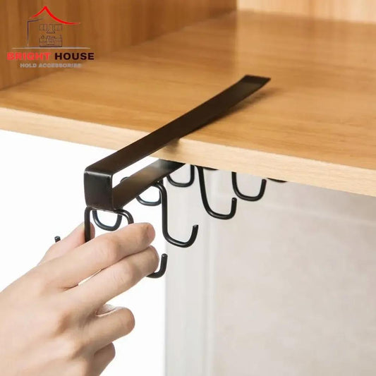 Black metal mug holder rack sliding onto a kitchen shelf