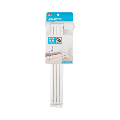 Packaged white three-arm wall-mounted towel rack